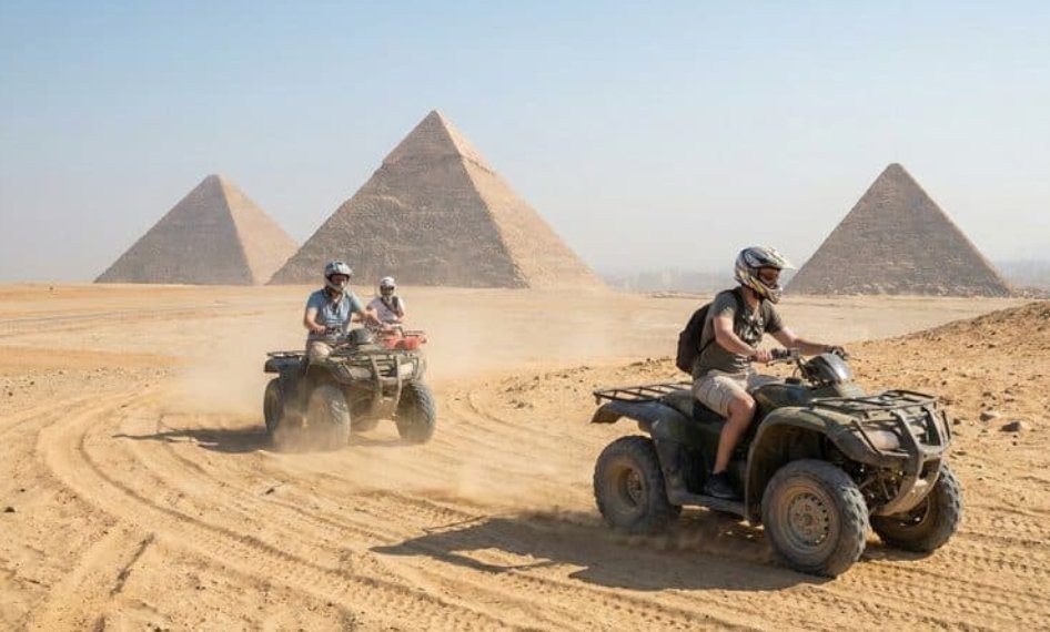 ATV quad bikes riding through the desert with a stunning view of Giza Pyramids